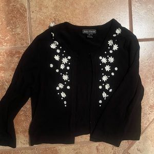 Size 16 Jessica Howard black sweater. Has Dainty white flowers w/ sequins.